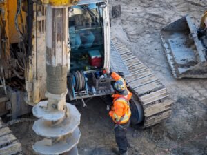 Engineer inspecting the drilling machinery